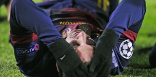 Messi Goes Down Injured as Barcelona draw with Benfica in final Champions League game